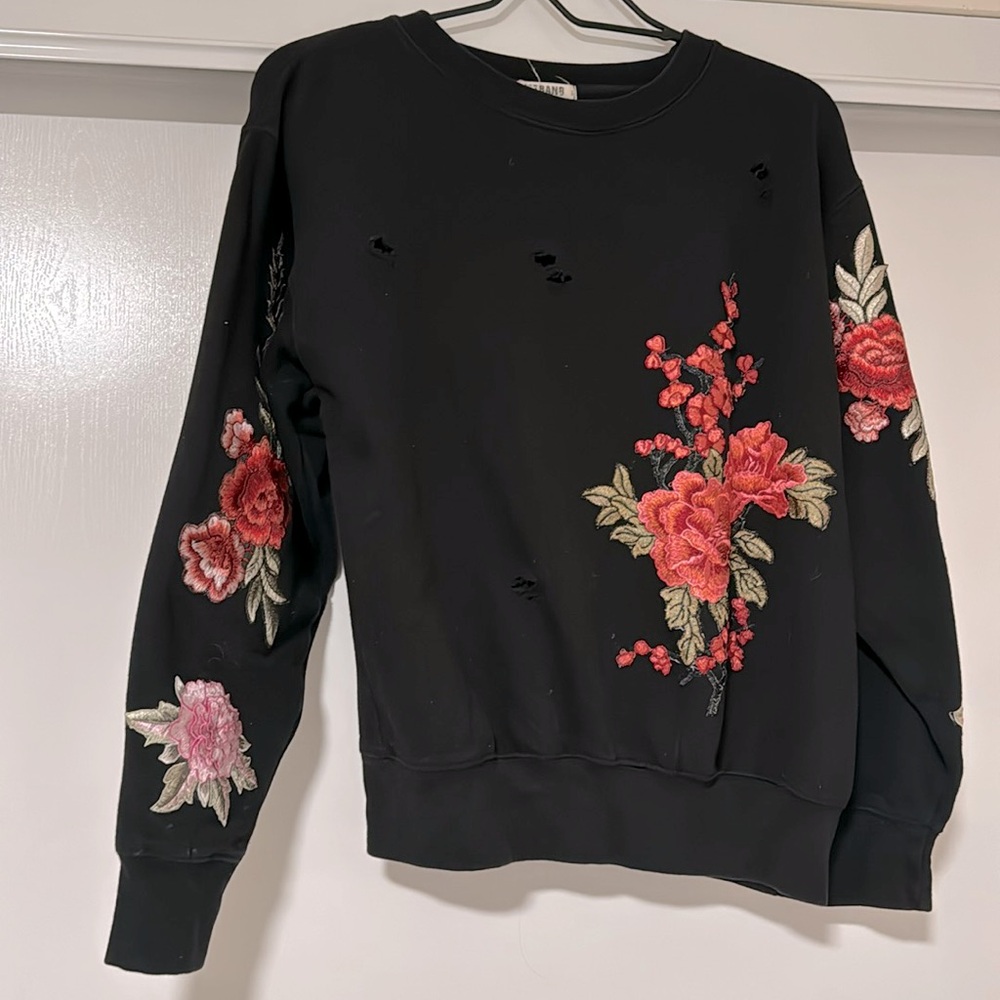 Ripped sweater with flower design. Small size.